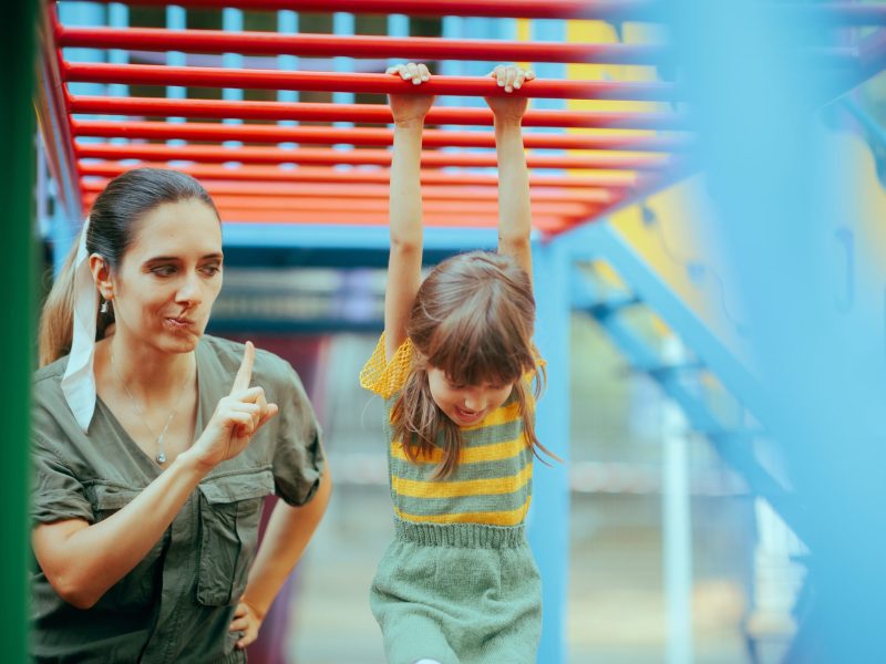 Mom,Forbidding,Her,Child,To,Climb,On,A,Dangerous,Playground