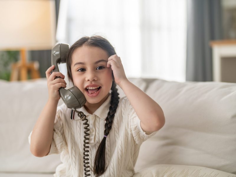 Little,Happy,Girl,Talking,On,Vintage,Retro,Telephone,Sitting,On